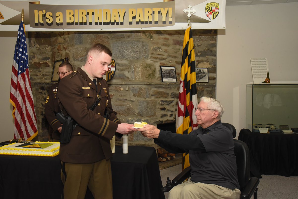 In a symbolic cake cutting ceremony yesterday, the youngest trooper is presented a slice of cake from the oldest trooper in attendance. This year's honor went to retired LT COL Frank Mazzone, 91, who passed a piece to TPR Porta, 21, a 156th Academy Class graduate.