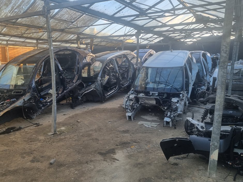 Dismantled cars in a warehouse in Crews Hill.