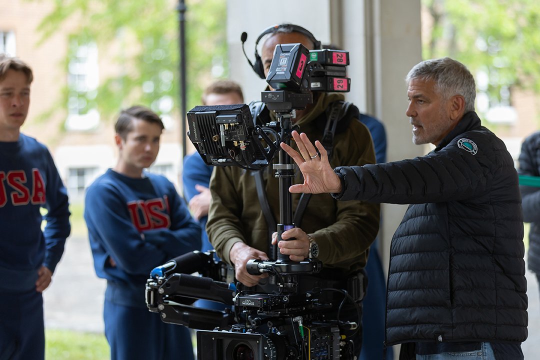 filminengland's tweet photo. 🚣‍♀️ Happy release day to #TheBoysOnTheBoat!

Directed by George Clooney, the biopic chronicles the University of Washington rowing team's inspiring journey during the 1936 Olympics.

The production shot at @StageFifty's Winnersh Film Studios &amp; in Wiltshire.

📸 MGM Studios https://t.co/hPOWlcbAD6