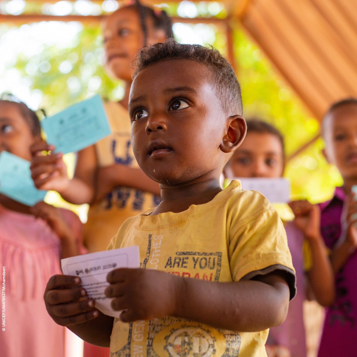 Children display their vaccination cards after receiving cholera vaccines through a UNICEF-supported vaccination drive in Madani Gezira State, Sudan. 
#ForEveryChild, Health