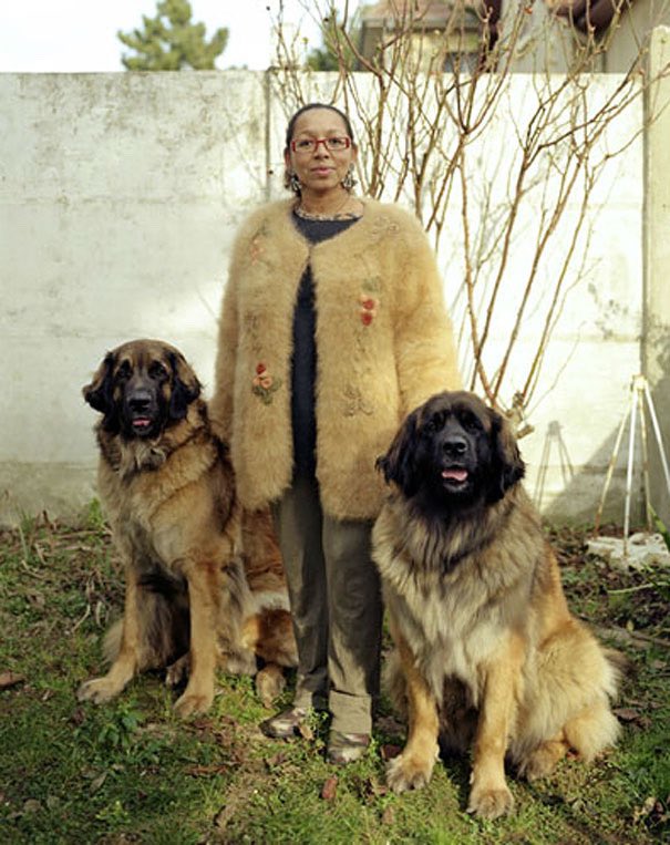 obsessed with these portraits of dog owners wearing clothes made from their pet’s fur