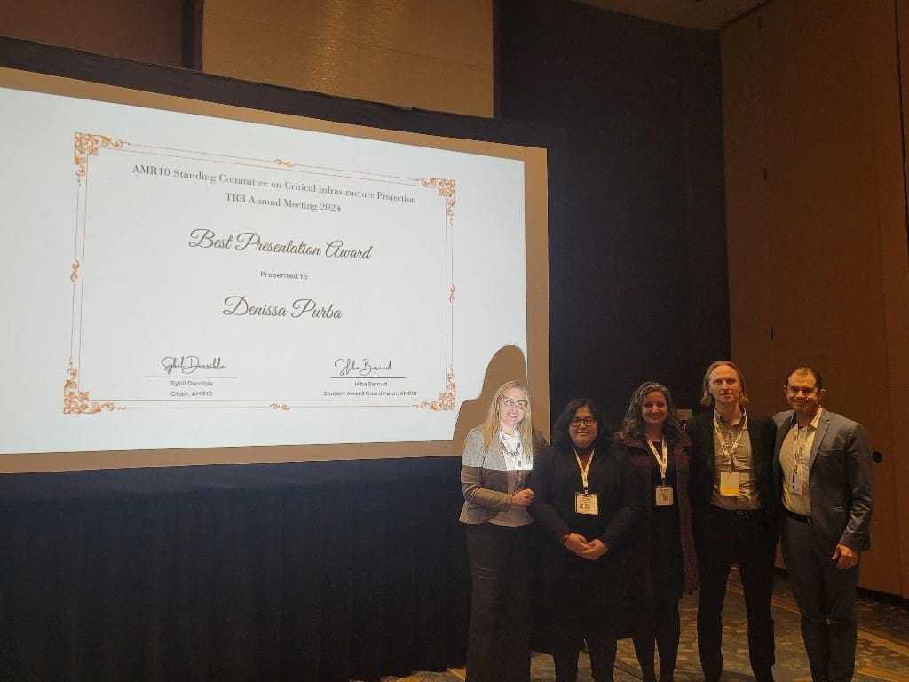 ria_kontou's tweet photo. 📣Congrats to our PhD candidate @PurbaDenissa for the Best Presentation Award of the AMR10 @NASEMTRB Committee on Critical Infrastructure Protection for her research on Vulnerability Assessment of #ElectricVehicles and Charging Station Network During Evacuations!🌪️🔋🔌⚡️🚘 #TRBAM https://t.co/FUVSvxxphy