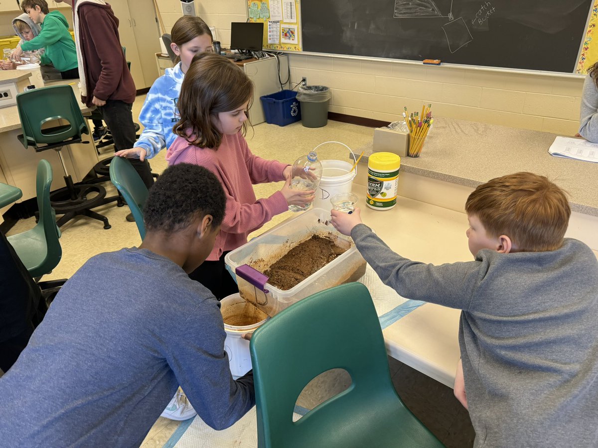 At the science lab running an experiment on rivers.