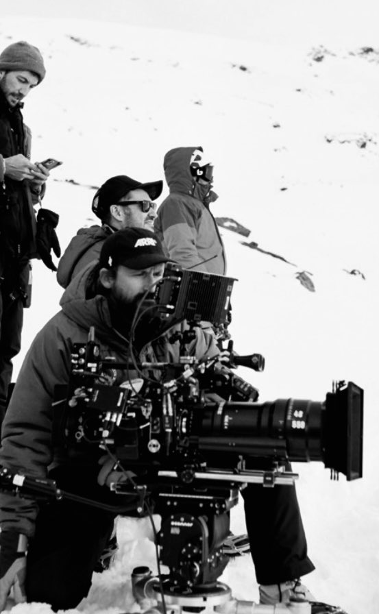 FilmBayona's tweet photo. How the main characters in Society of the Snow could end up blending with the environment, an environment devoid of life?
That was one of the goals our cinematographer @pedroluque set up for himself and the look for the movie. The approach was non other than letting the actors to be free around such environment which also liberated the camera allowing it to shoot whatever could happen spontaneously, at any moment. Pedro described it perfectly when he said that “the amalgam between the cinematographic and the documentary is the key to Society of the Snow, a very fine line between realism and the poetry of cinema.”

#SocietyOfTheSnow 
#LaSociedadDeLaNieve