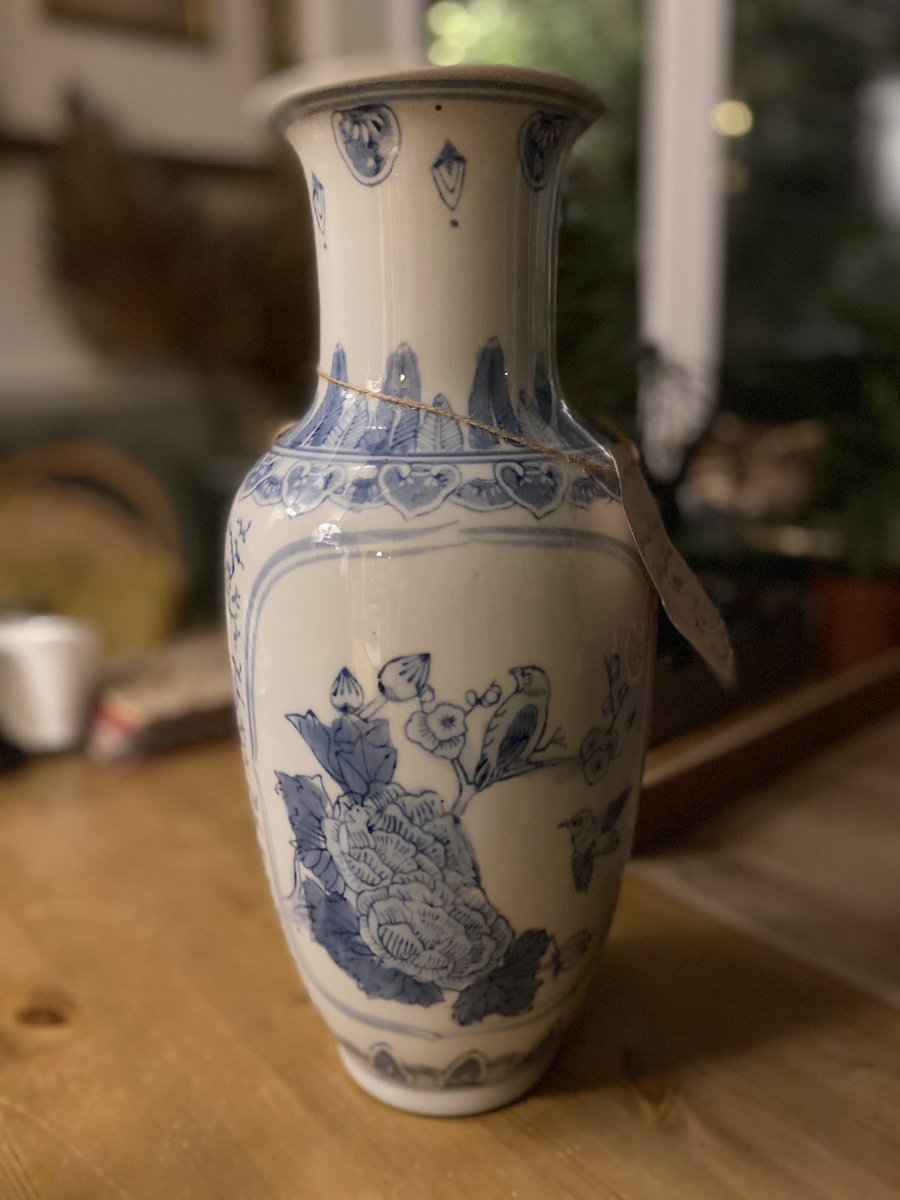 Gorgeous blue and white floral and bird motif vase.