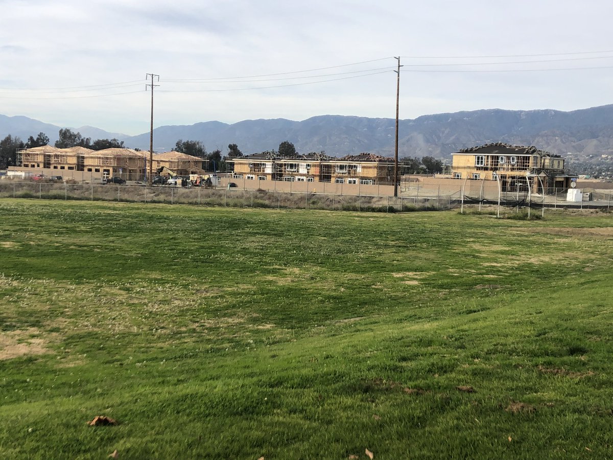 CVBHawkBaseball's tweet photo. Citrus Valley ⚾️ is getting a new background view over the left field fence. #OrangeGroves 🍊are gone and #Homes 🏠 are taking over. Hope the #Hawks will still #flyby #WErCV #TeamCV #PoundTheStone #Family #TheValley https://t.co/tDp5TORrUt