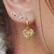 TheSwiftSociety's tweet photo. 📸| @TaylorSwift13 wearing earrings with a 'T' https://t.co/aenZIcspOB