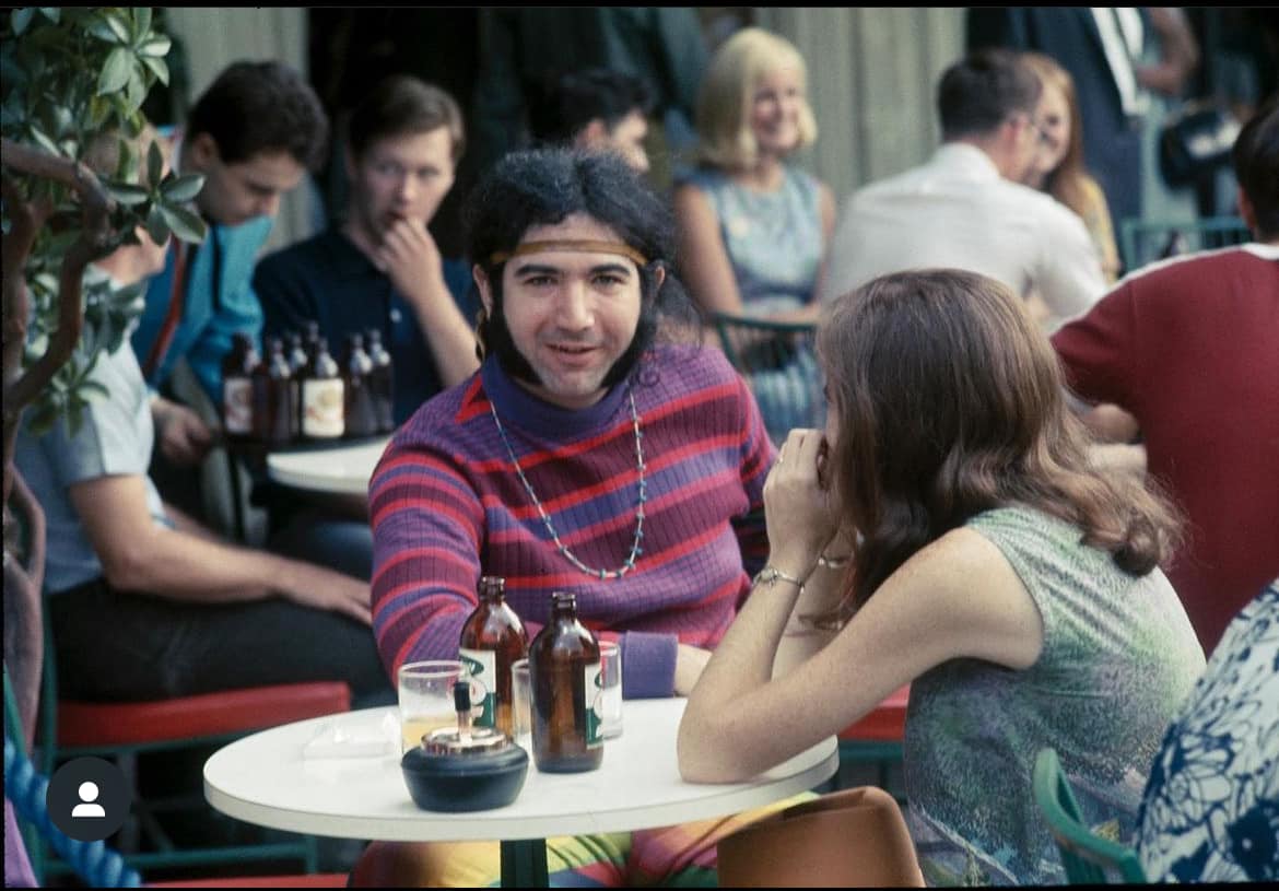Jerry Garcia and a friend enjoying the cafe's in Montreal, 8/6/67.  Photo by Ron Rakow.
