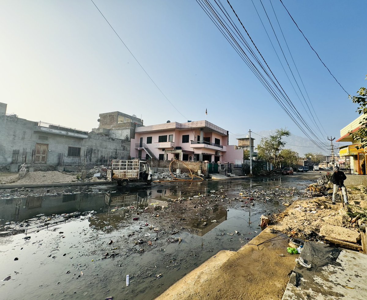 TalkToDileep's tweet photo. Hats off to our town's visionaries! The new road ingeniously blends gutter water and road, transforming cleanliness into an overrated concept. A masterpiece of urban chaos! Bravo, town planners! 🚧🌧️ #Sarcasm #UrbanCharm #jalore #headpostoffice @rpbreakingnews @News18Rajasthan https://t.co/RIRsNaanuG