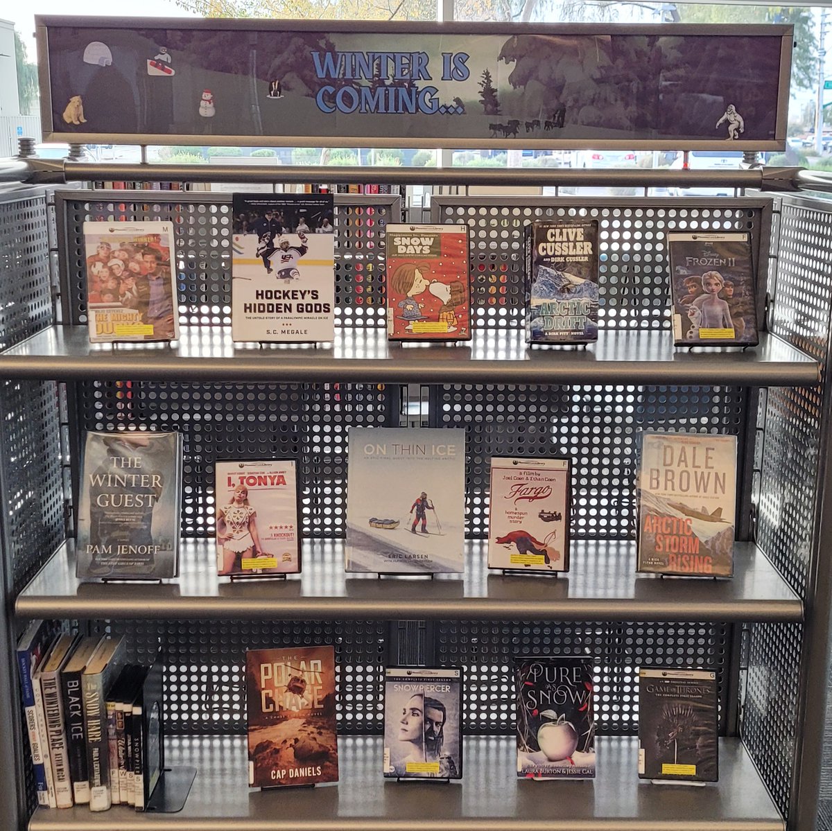 PhxLibrary's tweet photo. Brrr… Winter is Coming! ❄️Celebrate the cool weather with some wintry DVD and book titles from this display at #JuniperLibrary. Find something chilly for all ages. https://t.co/Gx1g43d2xj #JustReadPPL #PhoenixPublicLibrary #Phoenix #PHX https://t.co/48nrd0LcCY
