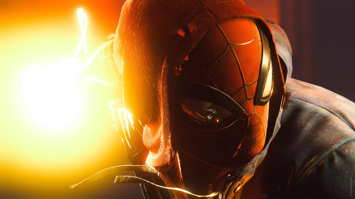 A close-up of Spider-Man, his hoodie ripped and torn, winding up for a Venom Strike punch.