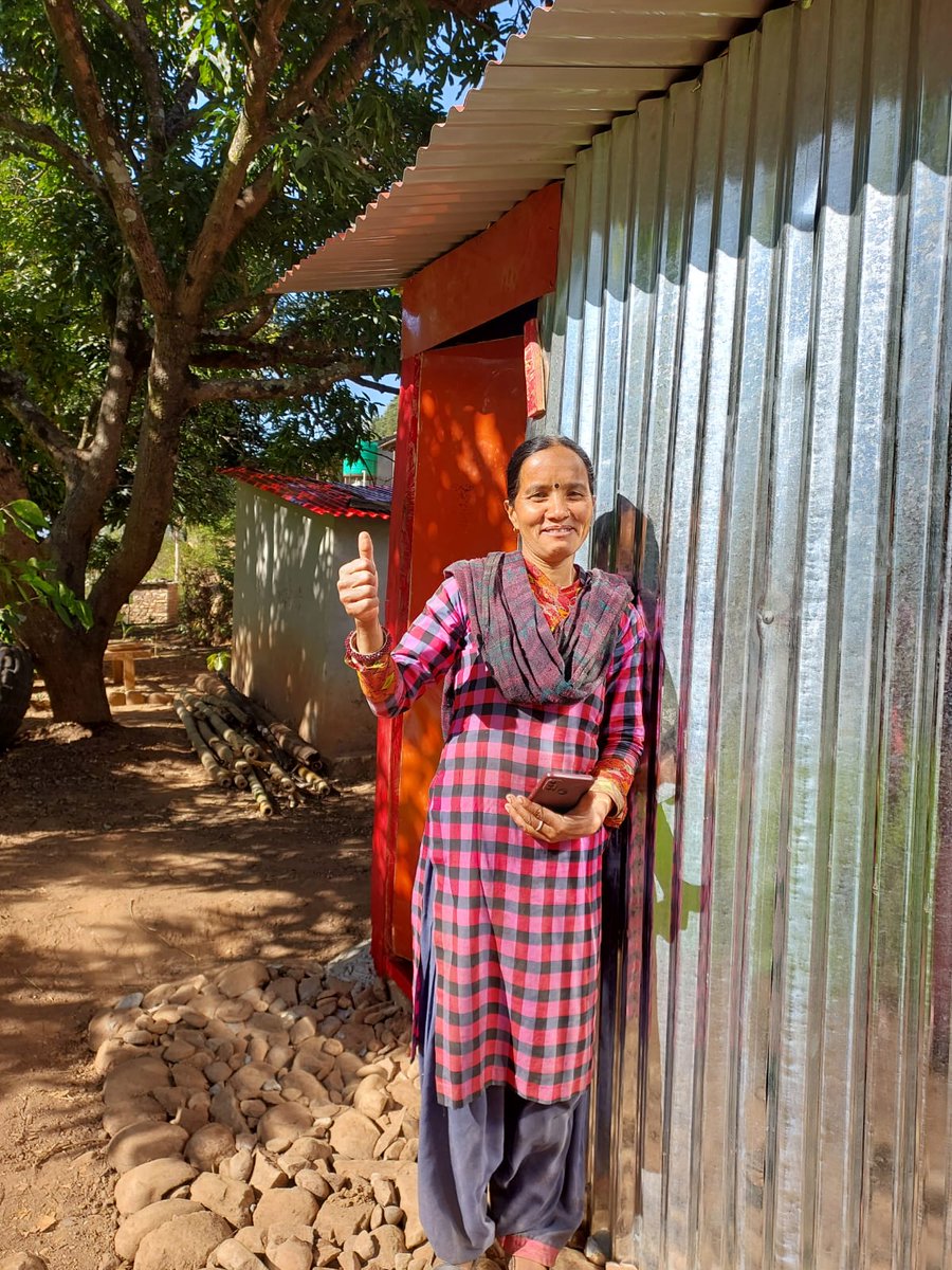 IFRCAsiaPacific's tweet photo. "This newly built transitional shelter provides me a feeling of home and safety.” 🏠 

With cash assistance from the @NepalRedCross and @ifrc, Kalika constructed not only a transitional shelter but also a toilet and water storage tank after the #earthquake destroyed her house. https://t.co/yrXgn4qVCZ