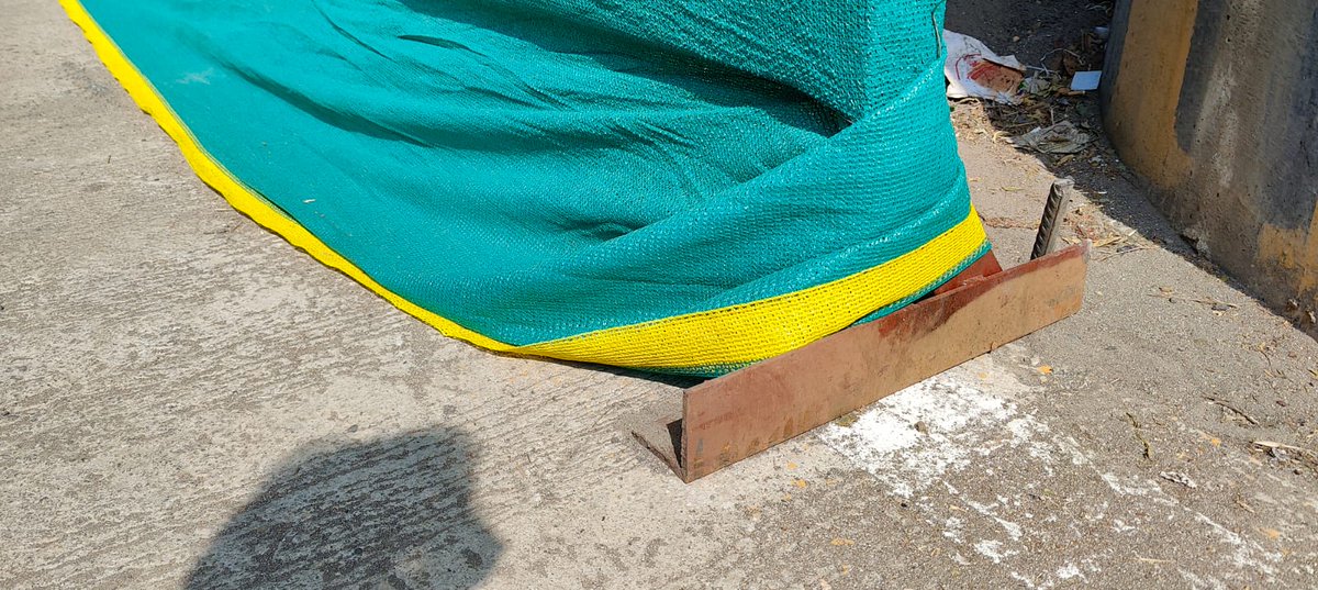 ravideas's tweet photo. The Metro Construction near Lodha New Cuffe Parade - near the Anik Bus Depot has some iron slats that have been covered with cloth since we have the PM visiting us, with no barricades usually. This has cut my Car's tyre since a Trucker pushed me to the extreme corner. Safetyissue https://t.co/bu6WLCXeHc