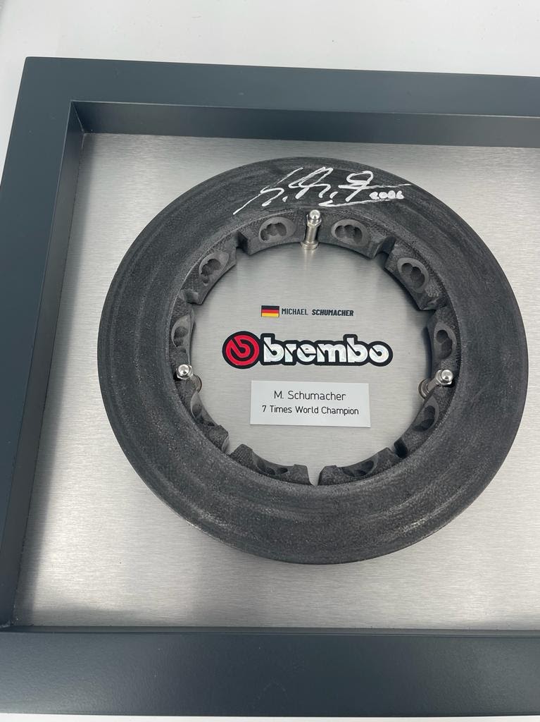 MemorabiliaExp's tweet photo. Michael Schumacher Ferrari Brembo brake rotor used on the Ferrari F2006 during the 2006 season.

This rotor has been hand signed by Michael Schumacher.

The frame is 26" x 18.5" (67 cm x 47 cm)
Price: $4,850 https://t.co/6s74LsopGO