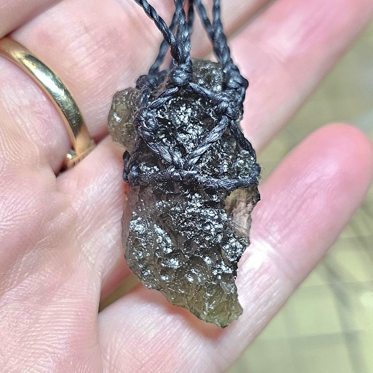 OrphicCrystal's tweet photo. It's so hard trying to get a good #workinprogress photo of this #custom order moldavite  #necklace as the cord blends into the surrounding dark green of the #crystal. Love working with this stone 💚
#fridaymorning
#FridayMotivation #smallbiz #handmade #handmadejewelry #spiritual https://t.co/W0nkg3ZMgt