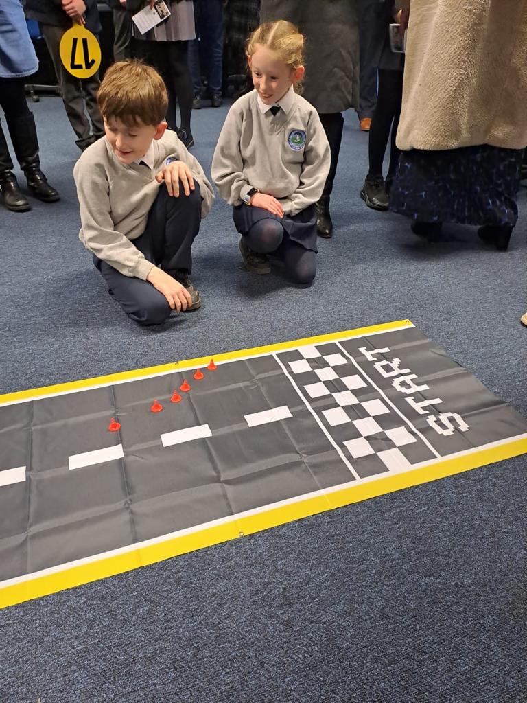 Primary 6 & 7 pupils having fun coding the Micro:Bits, Mini Sphero robots and an Arduino robot in the ICT department at our Open Day 2024.