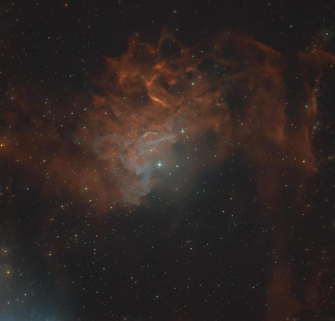 IC 405, also known as the Flaming Star Nebula, is an emission and reflection nebula located in the constellation Auriga. This intriguing celestial object is characterized by its vivid colors and intricate structures, resulting from the interaction between young, hot stars and