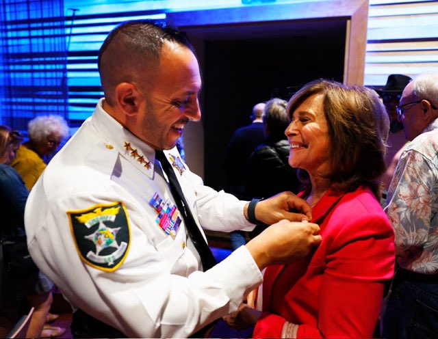 CommissBratton's tweet photo. As wonderful night at the Sanibel Big Arts Festival. I was glad to speak to those in attendance about policing in America — the history, where we are, and where we’re going — as well as my book, #TheProfession. 

My thanks to Sheriff Carmine Marceno for welcoming @rikkijklieman and I.
