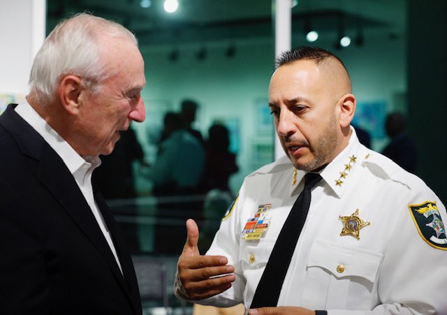 CommissBratton's tweet photo. As wonderful night at the Sanibel Big Arts Festival. I was glad to speak to those in attendance about policing in America — the history, where we are, and where we’re going — as well as my book, #TheProfession. 

My thanks to Sheriff Carmine Marceno for welcoming @rikkijklieman and I.