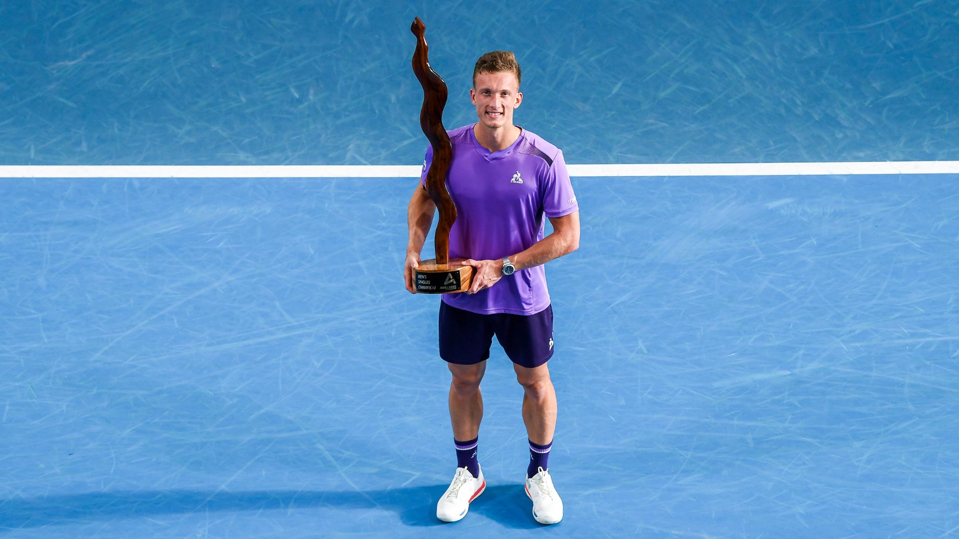 Jiri Lehecka of Czechia poses with the Mens Singles Champion trophy after winning his match against Jack Draper of Great Britain in the 2024 Adelaide International at Memorial Drive on January 13, 2024 in Adelaide, Australia. 