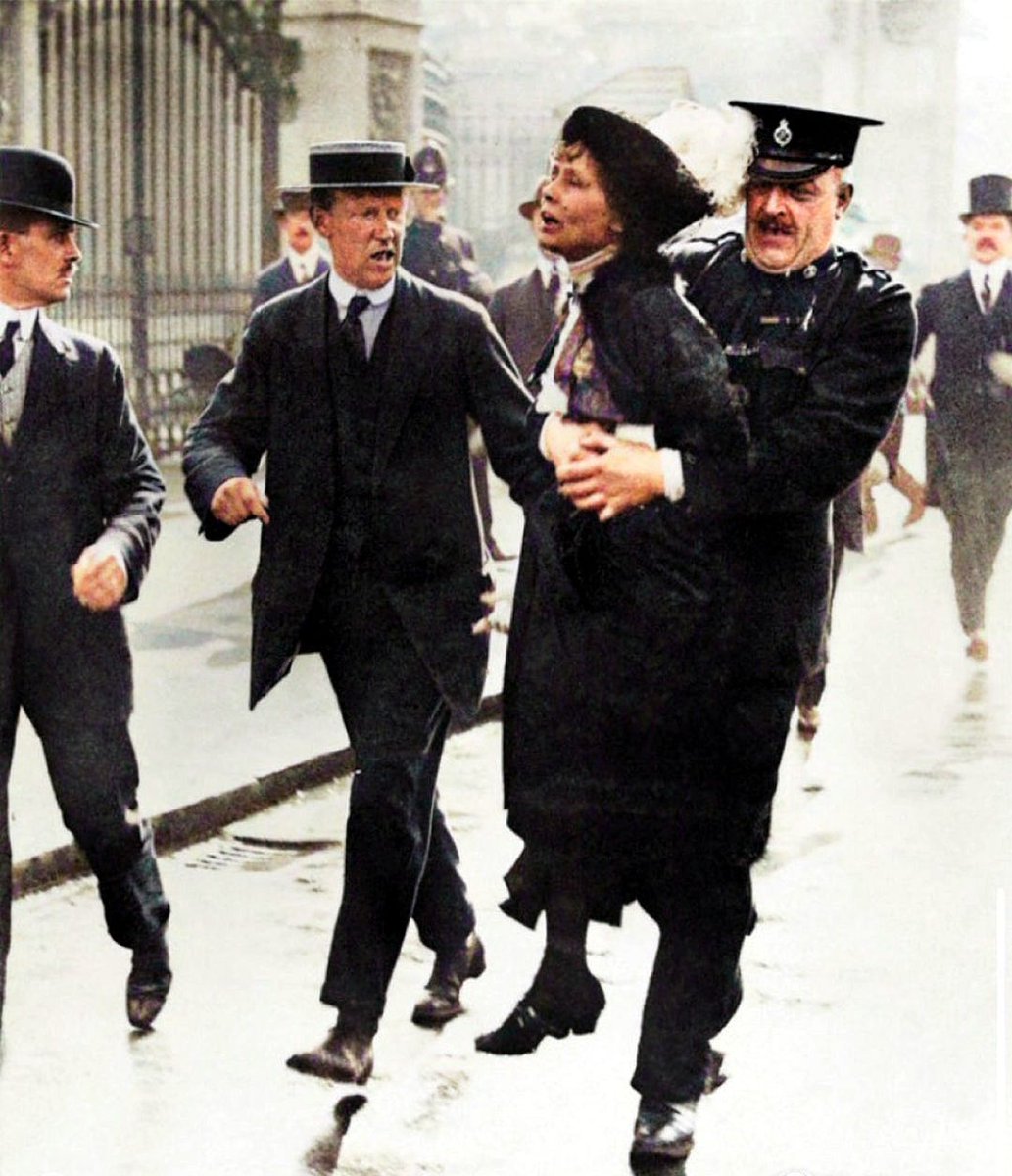 Suffragette leader Emmeline Pankhurst being carried away from Buckingham Palace in London after being arrested while trying to present a petition to King George V in 1914. #emmelinepankhurst #suffragette