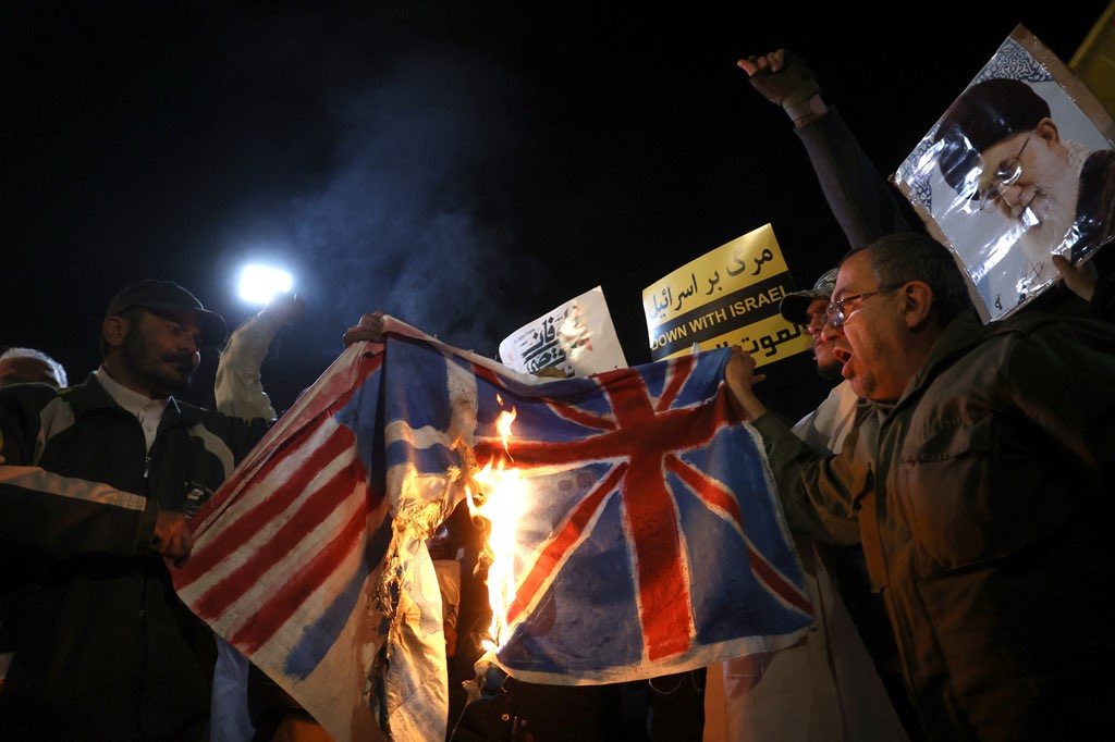 hg_may's tweet photo. Protesters burn flags of these countries during anti-US, British and Israeli protests in Tehran https://t.co/s9FUxpeyh8