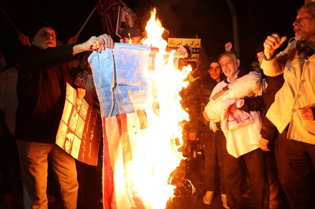 Protesters burn flags of these countries during anti-US, British and Israeli protests in Tehran