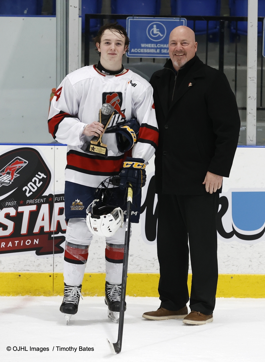 OJHL Chris Vanstone presents player of the game awards to David Green #4 of OJHL Prospects Team East and Landon Wright #14 of OJHL Prospects Team West.