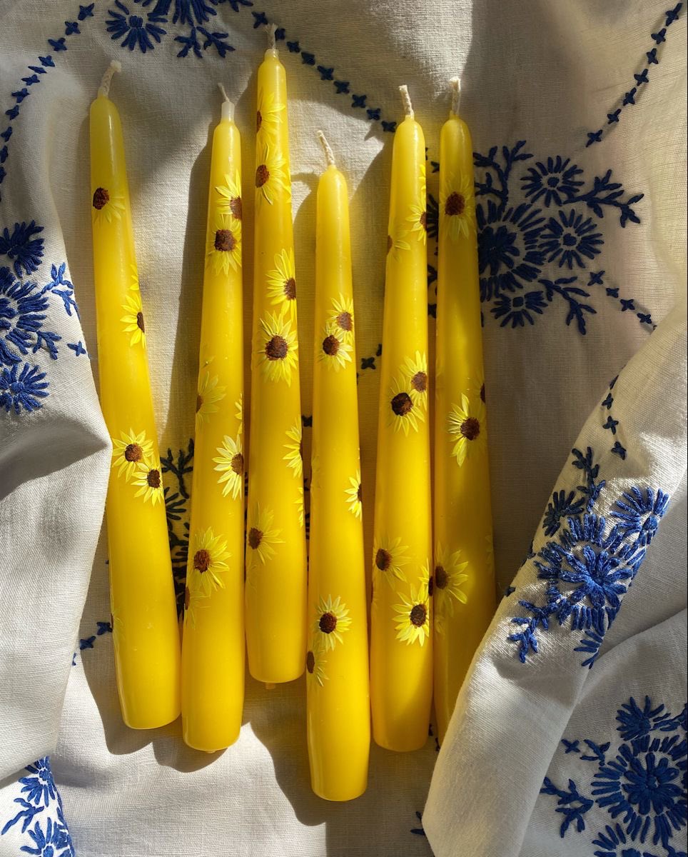 300moods's tweet photo. sunflower hand-painted candles 🌻 https://t.co/nKX5LJg0ba