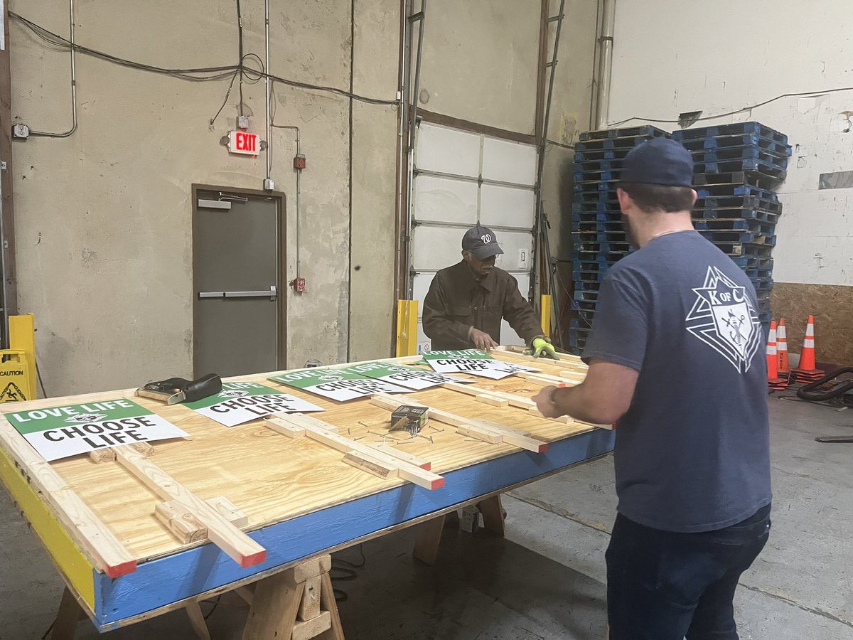 dckofc's tweet photo. Today, DC Knights and families are working together to prepare thousands of iconic @KofC signs for next Friday’s nat’l @March_for_Life in our Nation’s Capital. #knightsinaction https://t.co/NguRs3s7sA