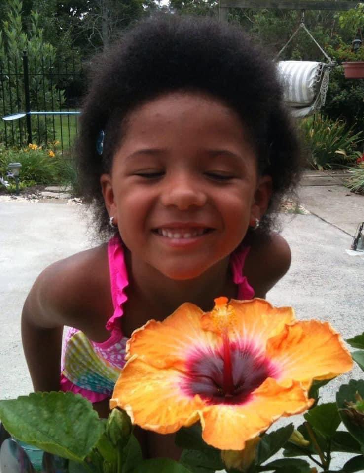 jamesdcooper4's tweet photo. My yearly reminder that the true beauty of a child knows no bounds. I will protect your child whether I know you or not. Imagine all of us protecting all children, that’s our power. Stop and smell the roses, even if the roses are really a giant hibiscus. #ProtectOneAnother https://t.co/SSwVVUTesE