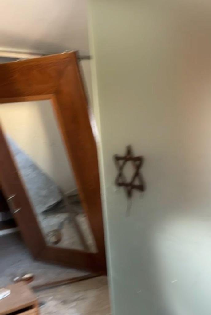 gazaheart's tweet photo. Israeli soldiers trashed our apartment in #Gaza and left antisemitic artwork on the walls. Why antisemitic? Because it incites hatred against Jews. You see, when you leave the star of David, a religious symbol, on the walls of homes you’ve invaded, trashed or demolished, when you imprint this symbol on tanks, bulldozers, and army uniforms of genocide perpetrators, you are conflating your brand of terrorism with Judaism, and this is antisemitic. Israel is antisemitic, and is harmful to Jews. It no more represents all Jews than Saudi Arabia represents all Muslims. As I see this graffiti on my bedroom wall and imagine soldiers in my home, and I think of my family in Gaza, the deaths, the destruction, I am more convinced than ever of the need for all of us to call out this sham, this lie, that it is antisemitic to criticise Israel. I believe it is antisemitic not to. #Antisemitic #palestine #israel #gaza
