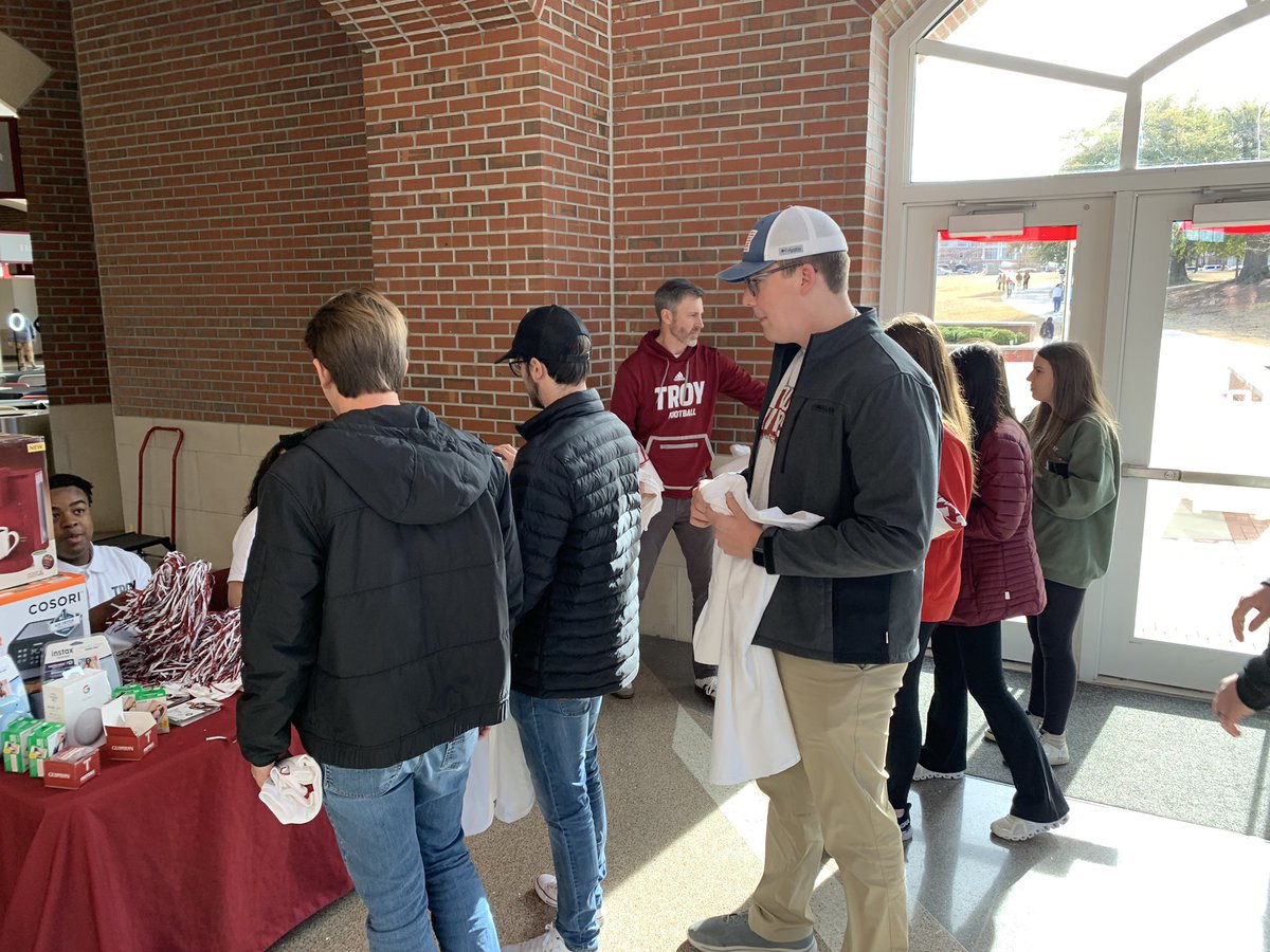 Thanks to the new members of the @TroyTrojansFB staff for joining us at today’s WHITEOUT Games for @TroyTrojansWBB and @TroyTrojansMBB and helping pass out shirts to fans! #OneTROY ⚔️🏀🏈