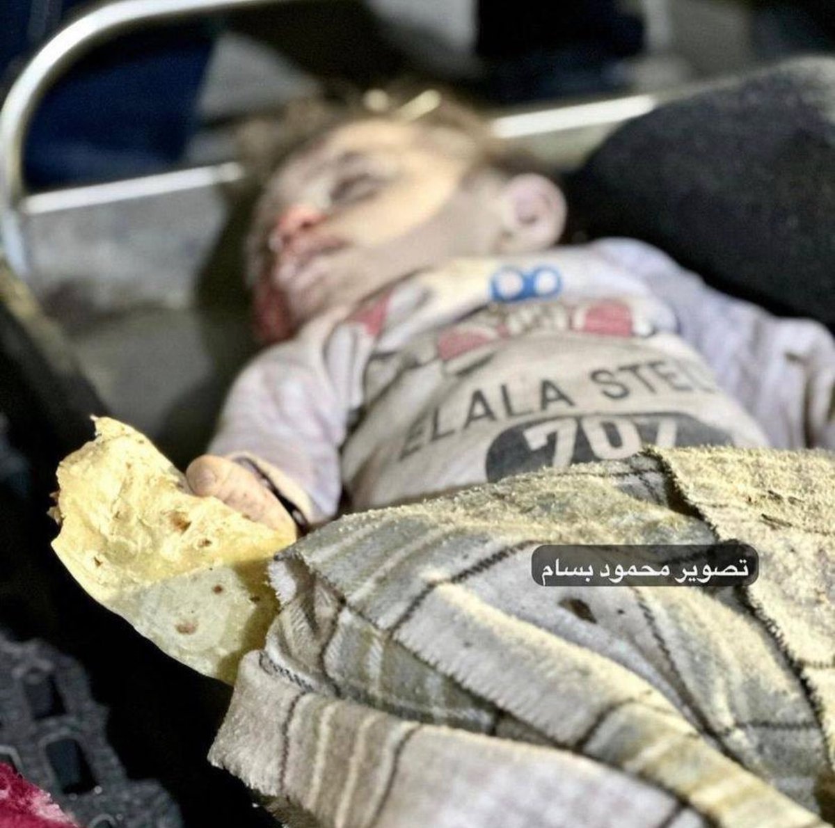 SHE IS 2 MONTHS OLD

STILL HOLDING HER PIECE OF BREAD

ISRAEL KILLED HER