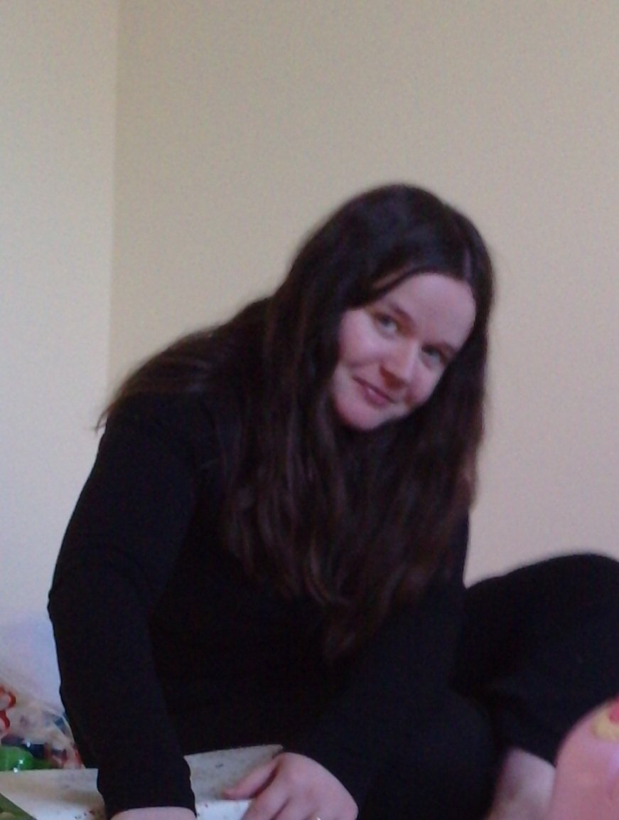 Me at 24, in 2009. I've not changed much except I now have furniture (I had just moved house and had no furniture so I'm sat on the floor)