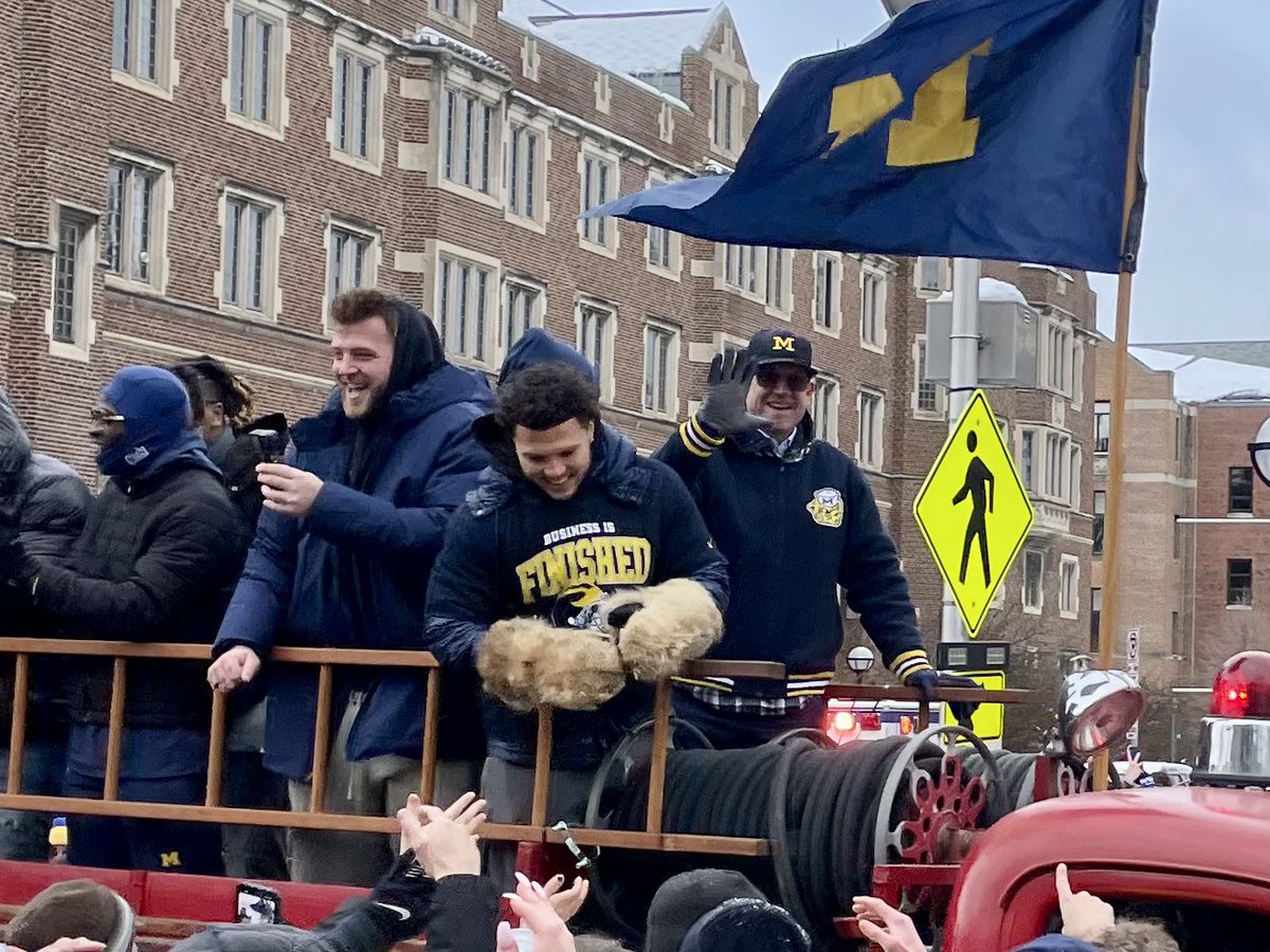 Jere_Freeman's tweet photo. Championship parade day. Wind chill wasn’t too bad at 12°, so took the #family to celebrate. #GoBlue #NationalChampionship https://t.co/HLznJp9bsA