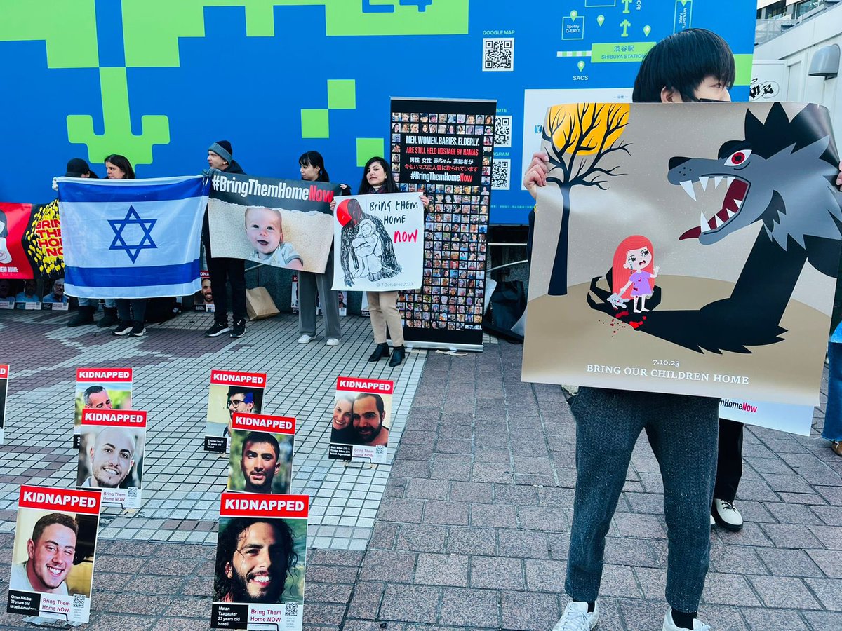 IsraelinJapan's tweet photo. From the youngest hostage, a one year old baby, to the oldest one at 86, women and men. It has been 100 days since October 7, and 136 hostages are still held by the terrorist organization #Hamas in Gaza. Today we stood in #Shibuya, ensuring their voice is heard.

We must #BringThemHomeNow, we must make sure that they reunite with their loved ones.🎗️

 #100DaysInCaptivity