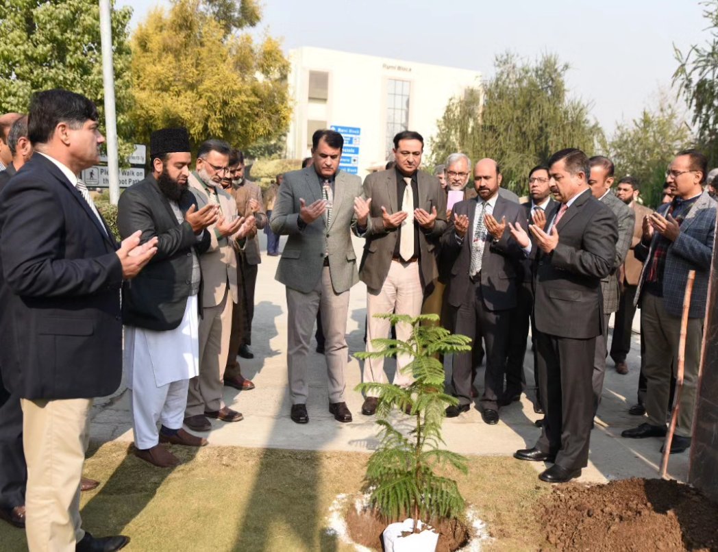 Rector NUML Major General Shahid Mahmood Kayani HI(M), (Retd) planting a sapling at NUML.