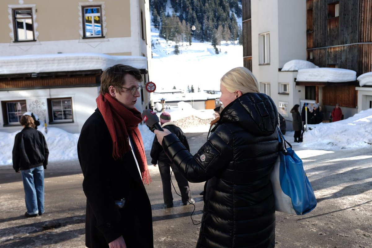 RaimondLueppken's tweet photo. Protest against #WEF at Postplatz in #Davos. #StrikeWEF #Davos1401 Picture 1 @nicola_siegrist talking to Swiss TV/radio @SRF. @klimastreik @spschweiz @JusoSchweiz @DebtforClimate https://t.co/CEVHJD7saP