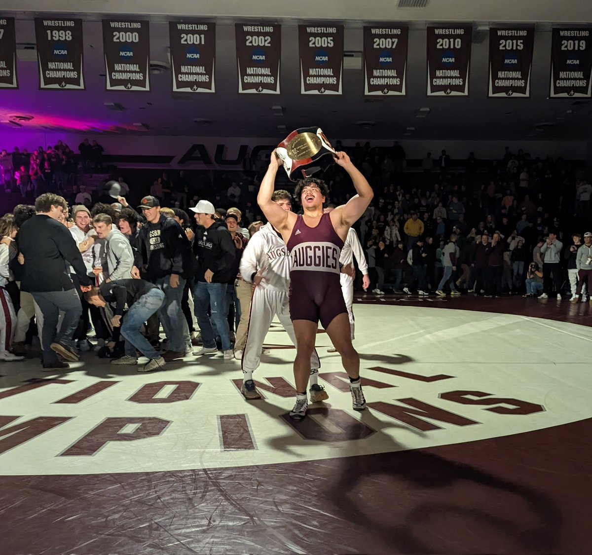 Yeah, Tyler Kim! Hoist that belt! Augsburg wins the Battle of the Burgs! #d3wrestle #AuggiePride