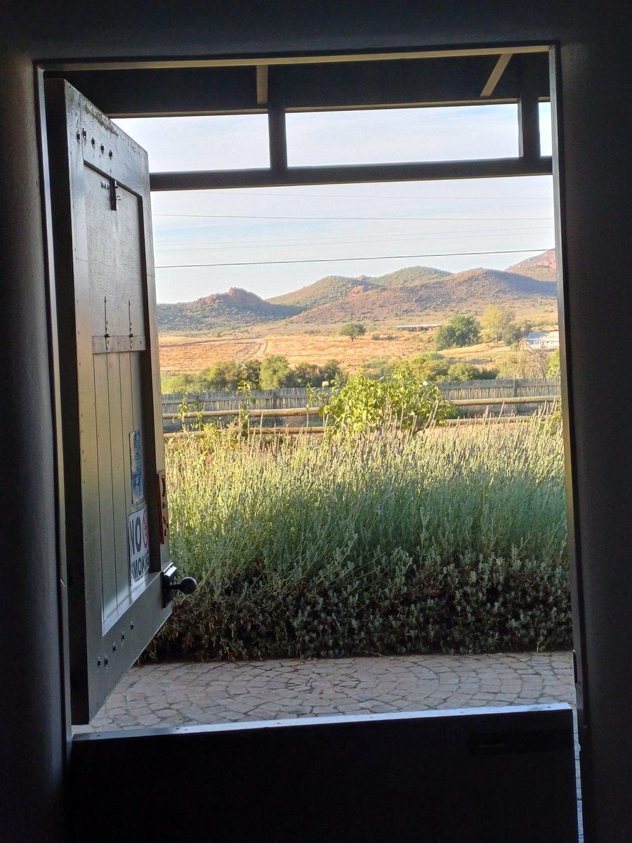 a door with a view!
swallows fly in,
admire themselves in the mirror 
and have a chat.
off to the Meiringspoort, 
then Swartberg,
fire-cooked pattat for padkos

have a rustige day,
goeie môre