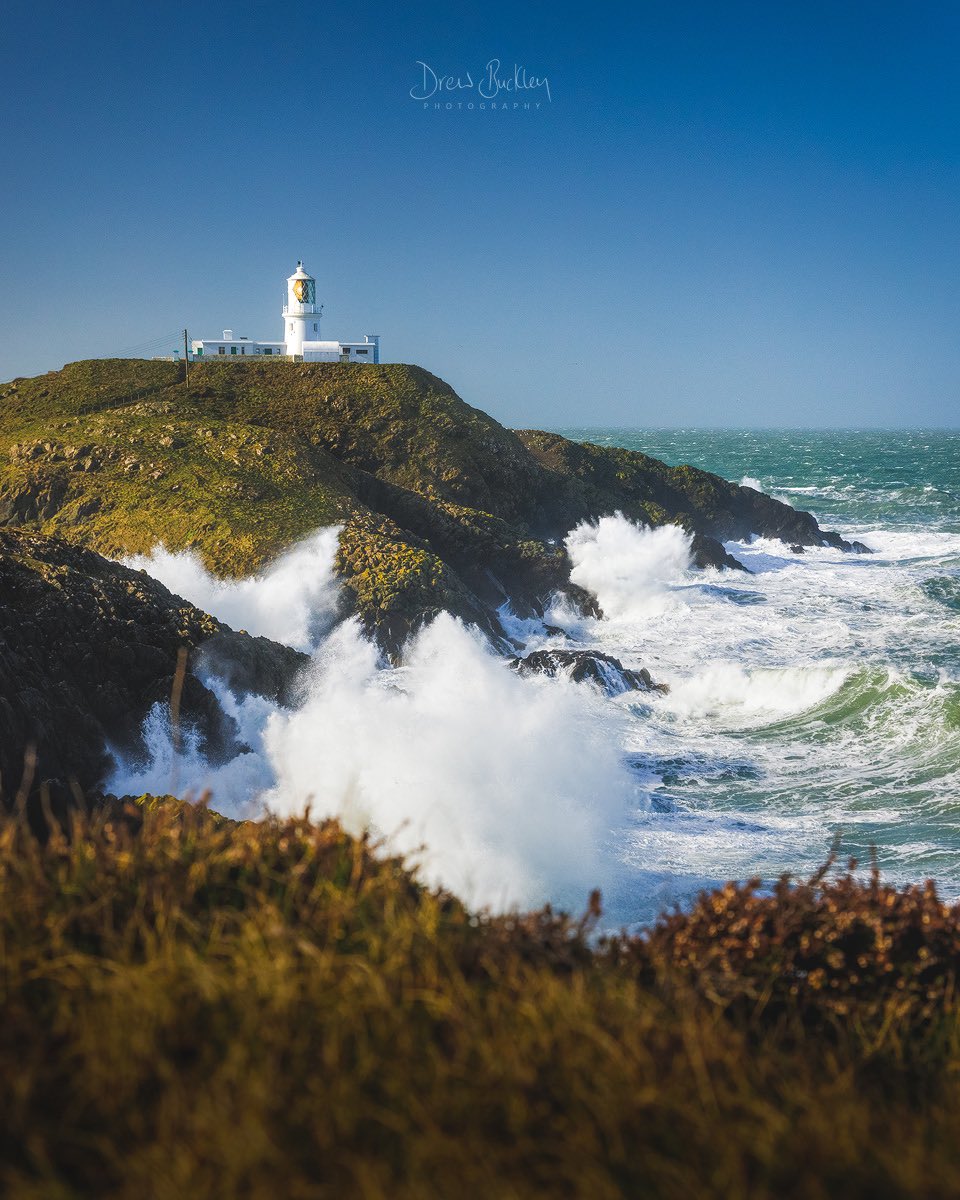 Strumble Storms 🌊 The tail end of Storm Franklin whips up the Irish sea with large waves that crash into Strumble Head and its iconic lighthouse #Pembrokeshire #Wales