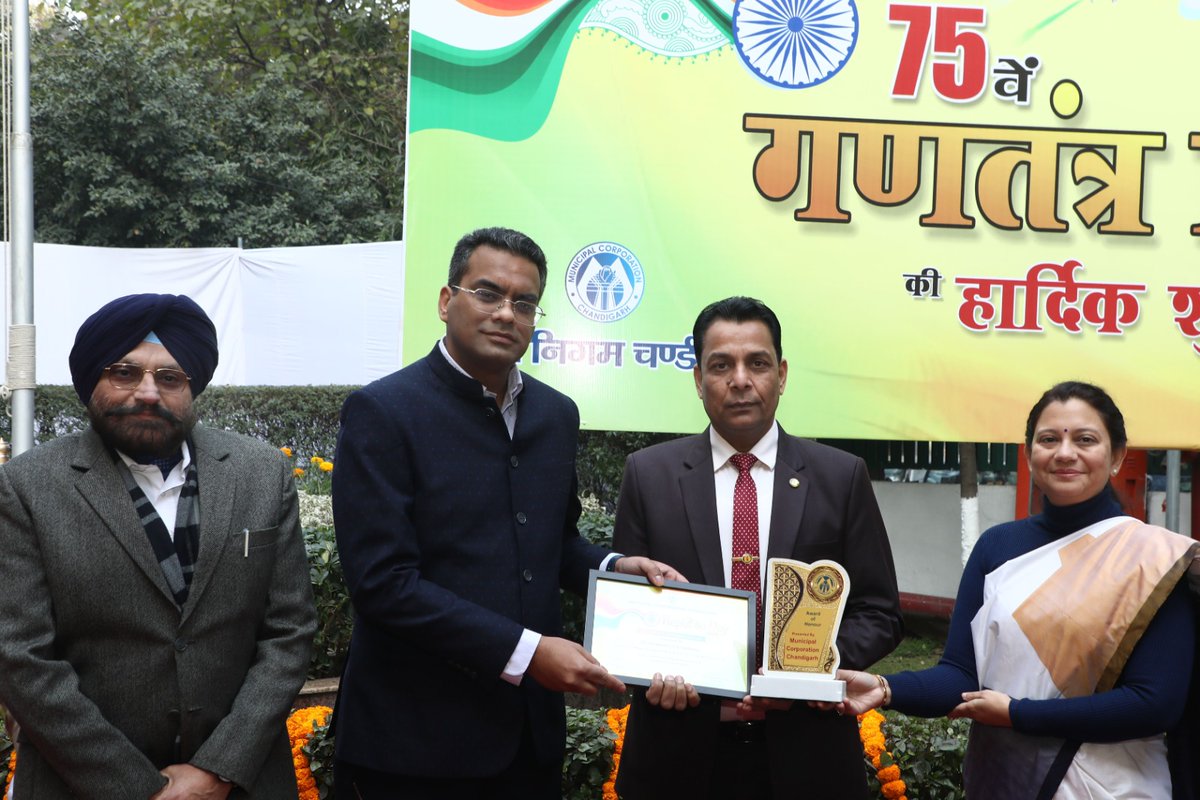 Sh. Chaman Lal Shienhmar, Field General Manager, Punjab & Sindh Bank, was honored by Mayor Sh. Anup Gupta and Commissioner Ms. Anindita Mitra at the 75th Republic Day celebrations for the bank's support in providing insurance claim facilities to all employees of the MCC