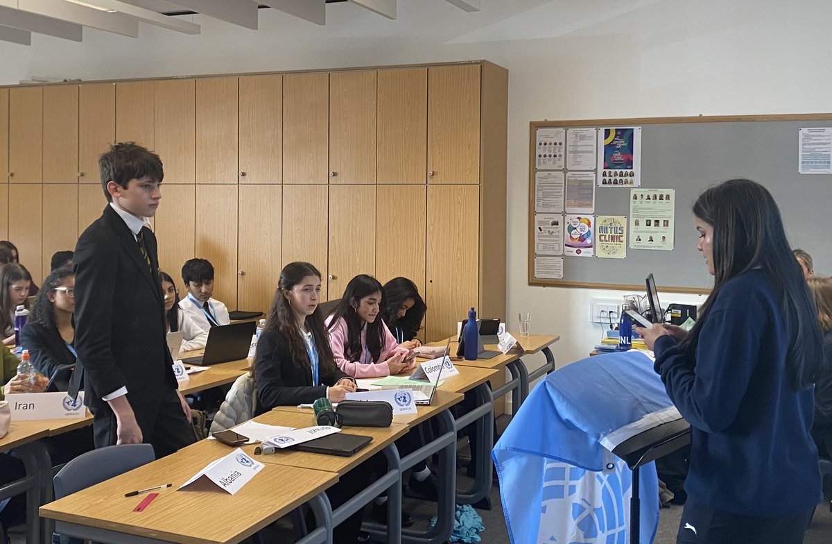 MunHampton's tweet photo. The Special Committee debating the topic of the illicit arms trade. Cassian B-S raising a Point of Info and Digby J listening intently at his first MUN conference. https://t.co/R8xkRHCdny