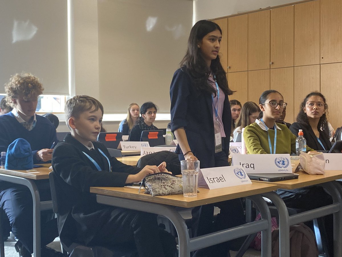 MunHampton's tweet photo. The Special Committee debating the topic of the illicit arms trade. Cassian B-S raising a Point of Info and Digby J listening intently at his first MUN conference. https://t.co/R8xkRHCdny