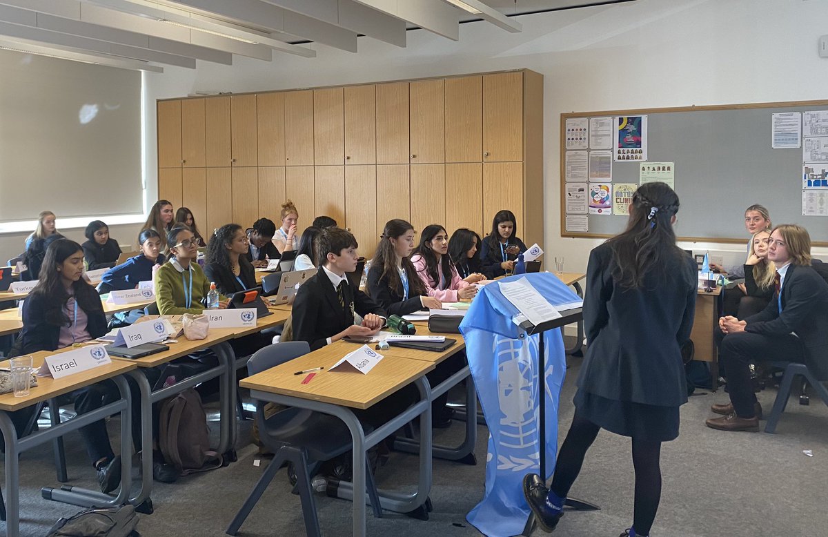 MunHampton's tweet photo. The Special Committee debating the topic of the illicit arms trade. Cassian B-S raising a Point of Info and Digby J listening intently at his first MUN conference. https://t.co/R8xkRHCdny