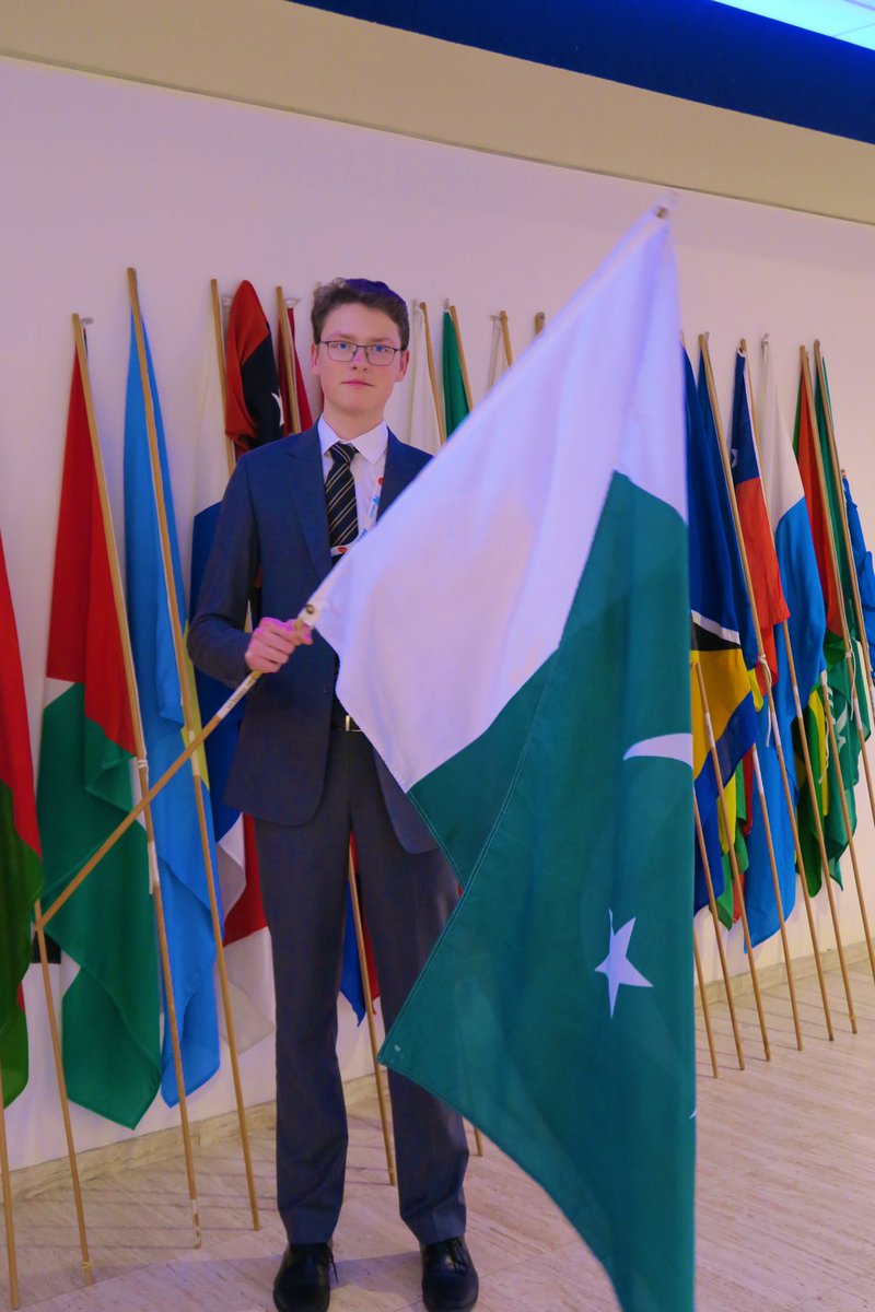 Deputy Ambassador James flying the flag before the #thimun closing ceremony
