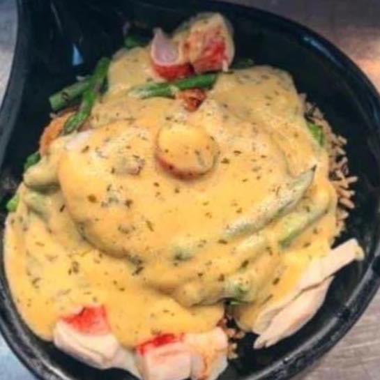 Mona’s Saturday night special: Chicken Oscar - a grilled boneless chicken breast, laying on a bed of long grain and wild rice, with steamed asparagus, crab meat, and smothered in buttery Hollandaise sauce - 4:30-9:30PM, call 815 452-2303. Full menu available