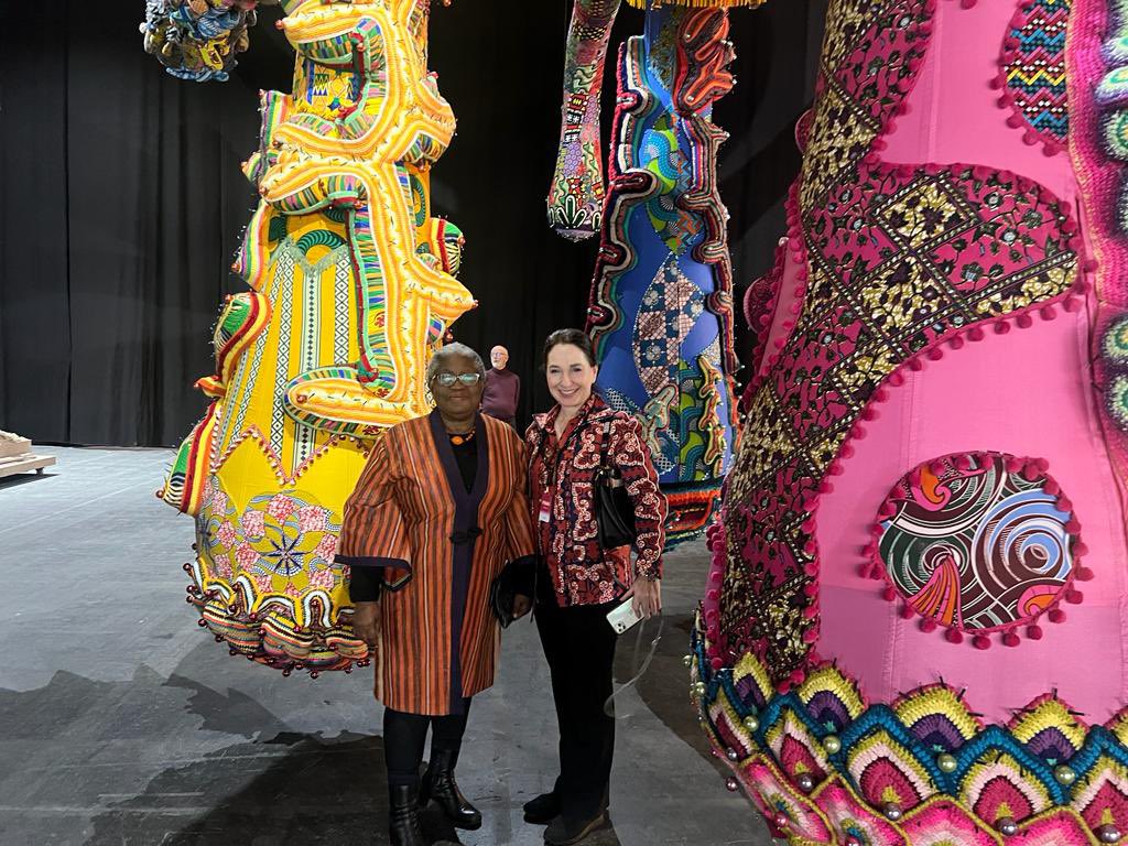 NOIweala's tweet photo. An afternoon at Art Genève admiring the fantastic giant work by renowned Portuguese artist Joana Vasconcelos. With great imagination and creativity she works with women to create art that also generates good jobs. Entitled Valkyrie Mumbet after the first slave to be freed in Massachusetts in 1781 - Elizabeth Mumbet Freeman, she uses African fabrics from former Portuguese colonies Angola and Mozambique as well as elsewhere in Africa along with other materials to create a meticulously detailed piece. Bravo Joana! Also with  Laura Gowen, owner of Gowen Gallery, who put it all together.