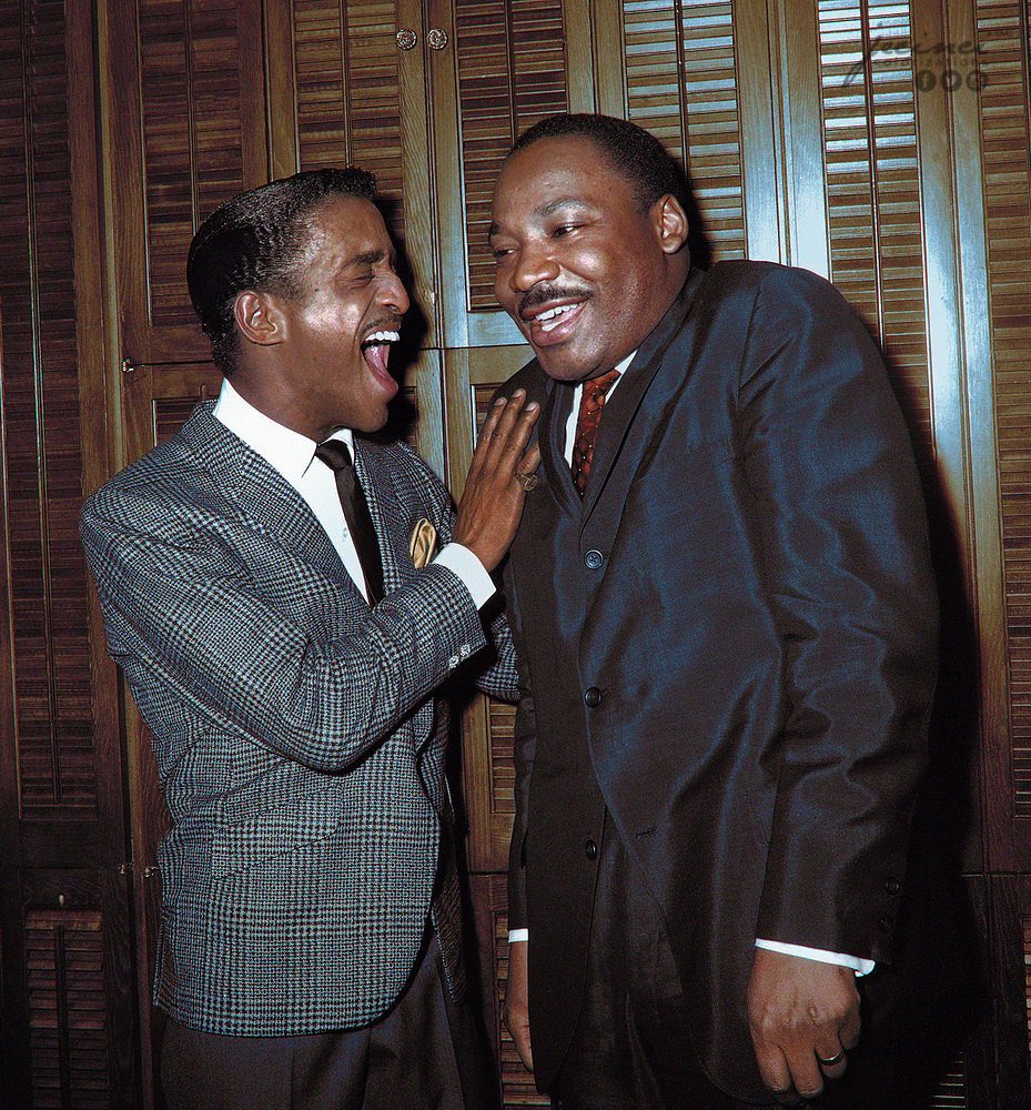 Martin Luther King Jr. and Sammy Davis Jr. share a laugh in Davis' dressing room at New York's Majestic Theater in 1965.